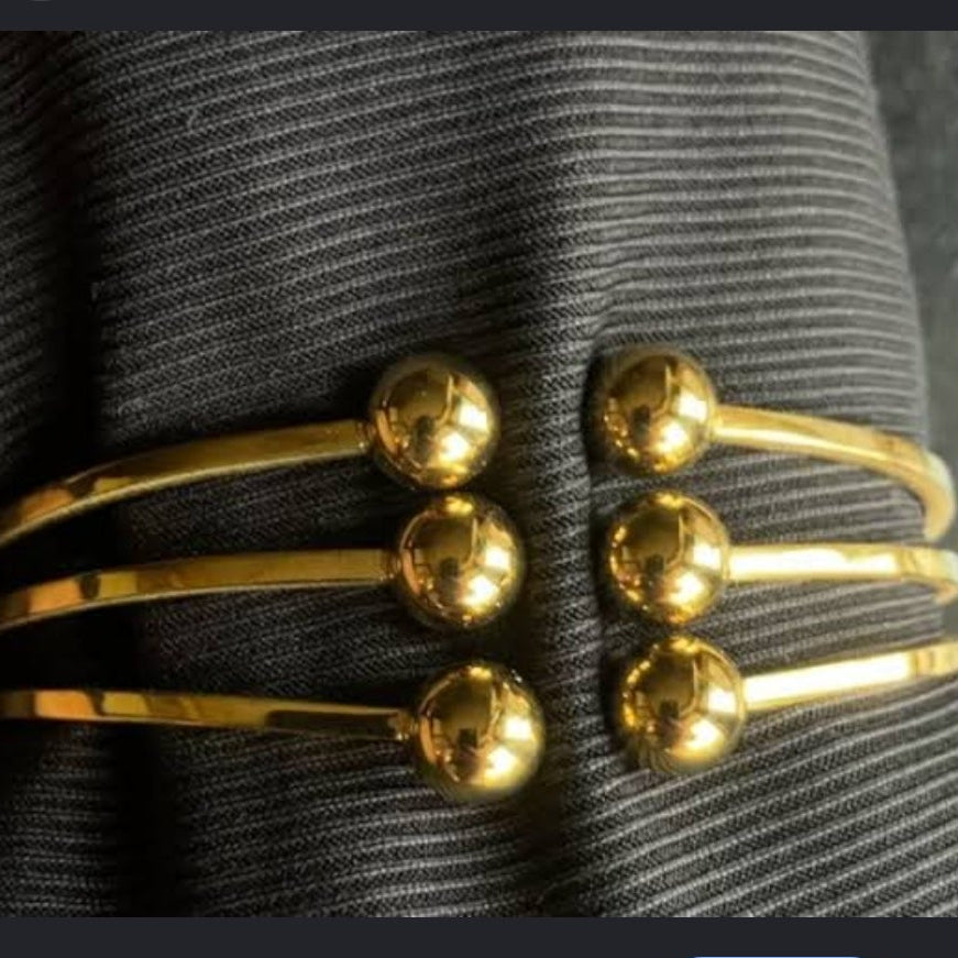 Golden handcuff triple ball design