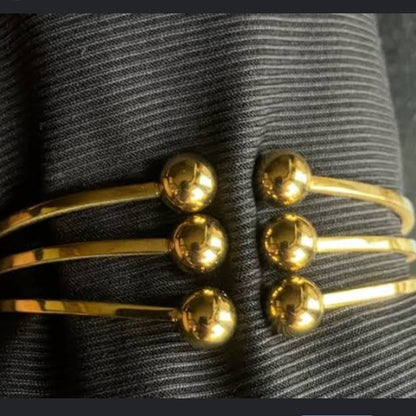 Golden handcuff triple ball design