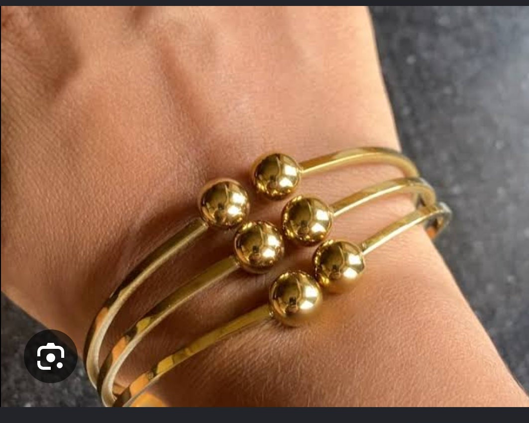 Golden handcuff triple ball design