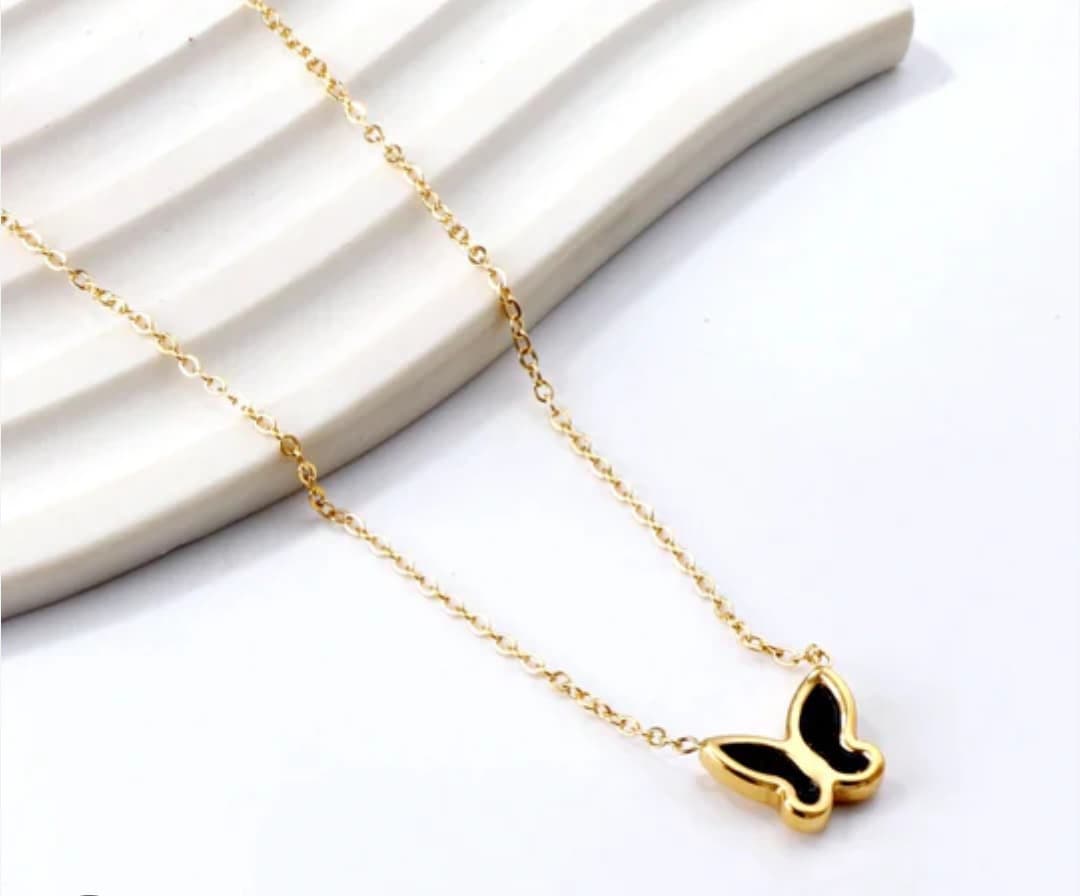 Stainless steel butterfly locket with mother of pearl inlay